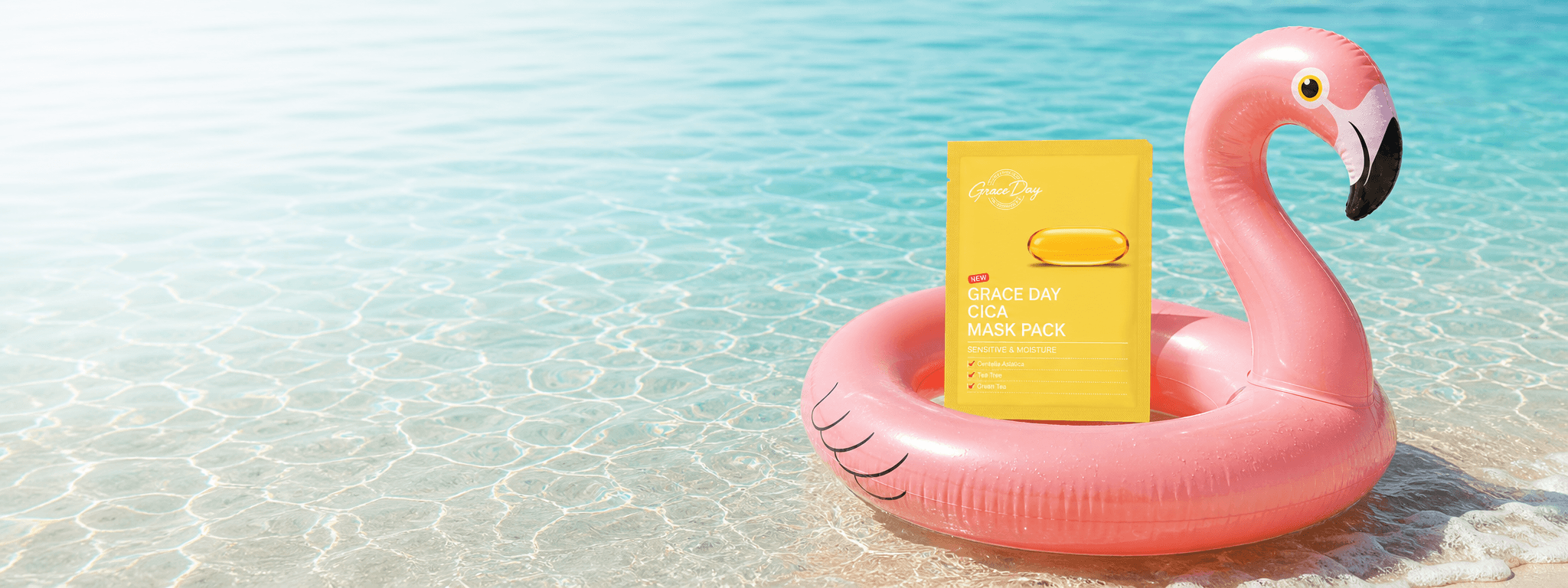 Grace Day mask pack on a pink flamingo tube in clear beach water